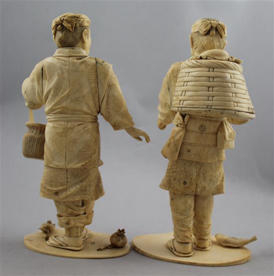 A pair of Japanese bone and ivory sectional figures of fruit pickers, early 20th century, 21cm and 22cm, losses